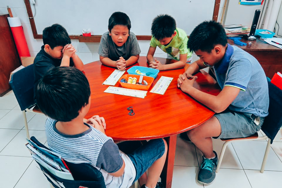 Children at BAIS go through Bible studies to stay rooted in the Word of God. Here, Krystal's students take a moment to pray for each other. (Photo: Krystal Ripley) 