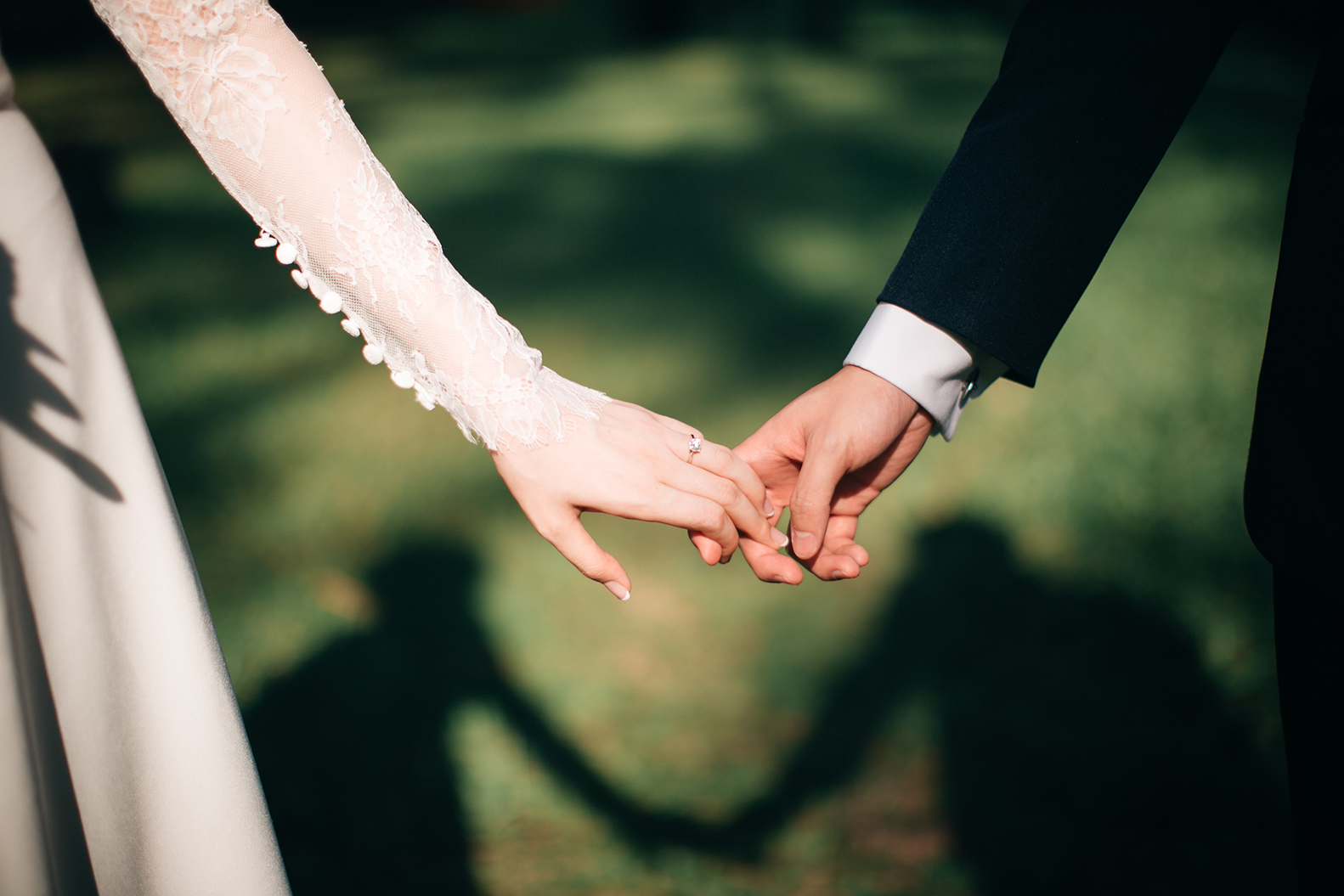 Wedding couple holding hands